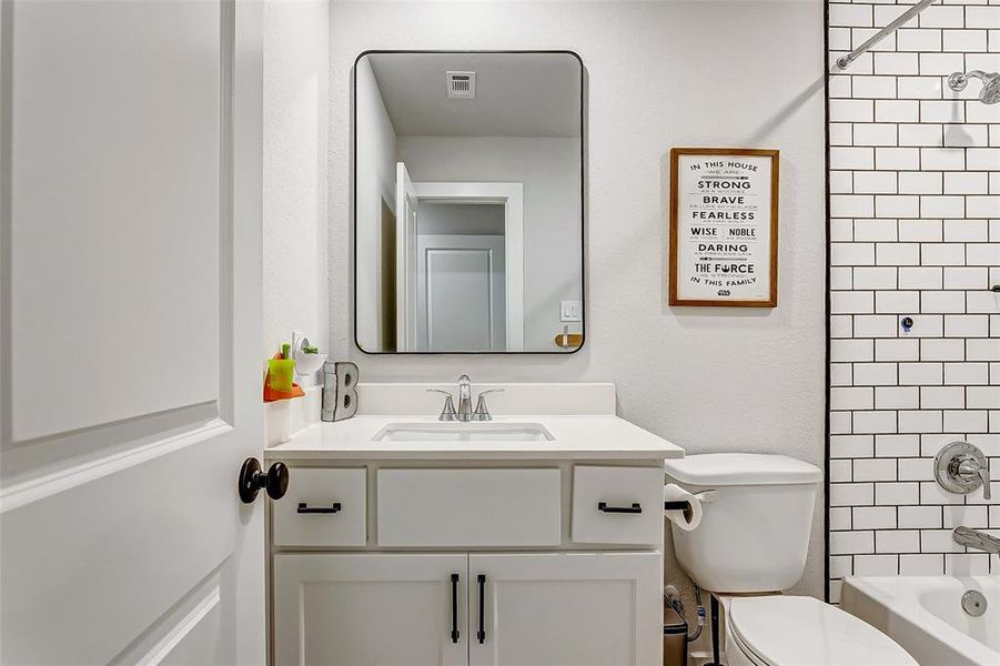 4th full bathroom with custom mirrors, floor to ceiling tile, Schluter trim and beautiful cabinetry.