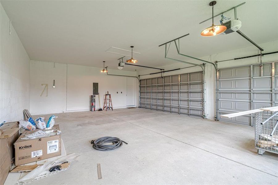 3 car side entry oversized garage with dual garage door openers