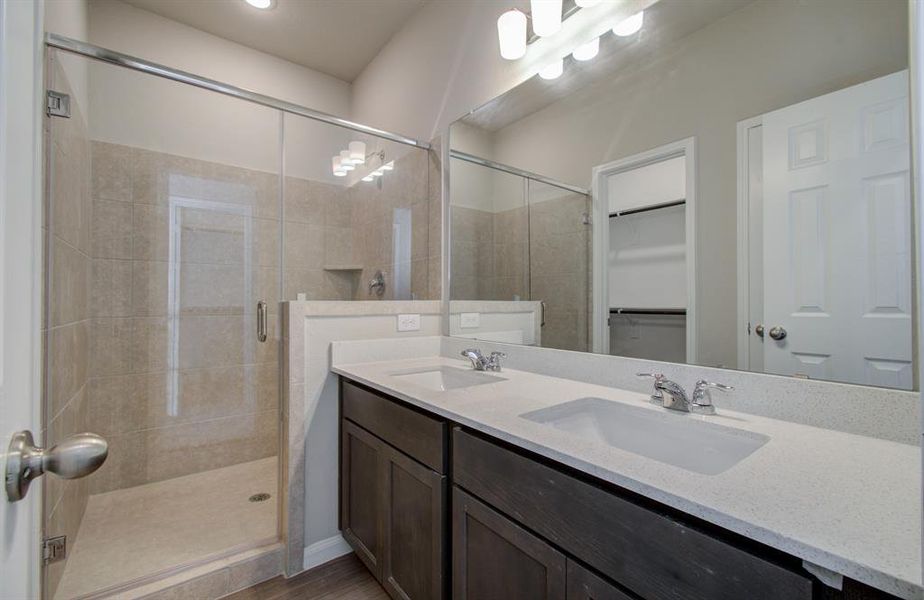 Lovely primary bathroom with double vanity & walk in shower