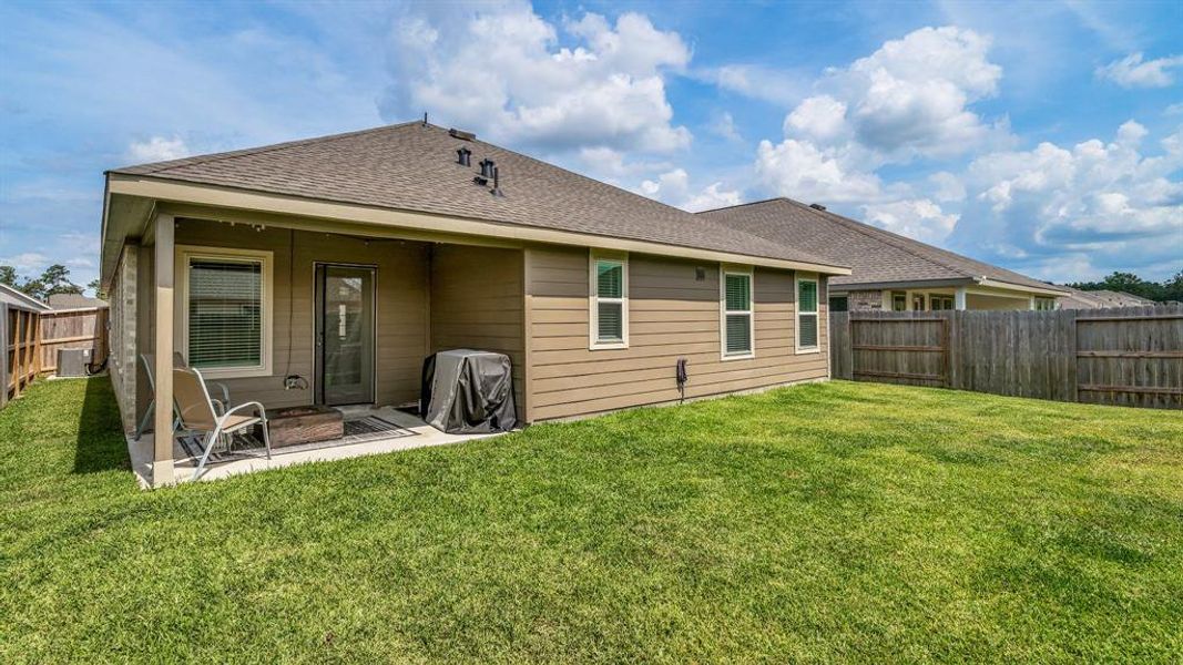 Fenced in back yard and a covered patio is perfect for enjoying a quiet evening.