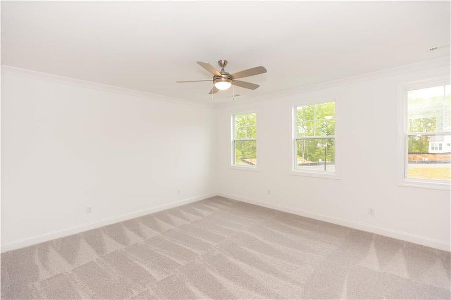 The primary bedroom has plenty of room for a king size bed, side tables and a dresser. Not actual home. Photos of previously built Stockton plan.