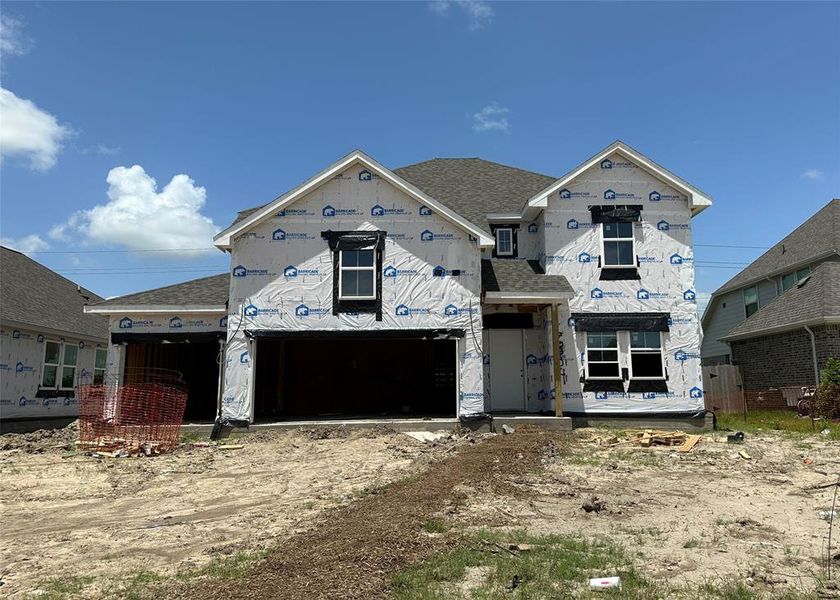 Two-story home with 4 bedrooms, 3.5 baths and 3 car attached garage