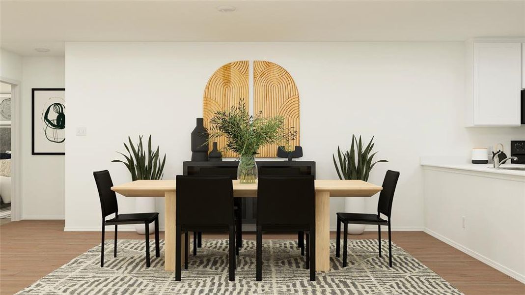 Dining space featuring hardwood / wood-style floors and sink