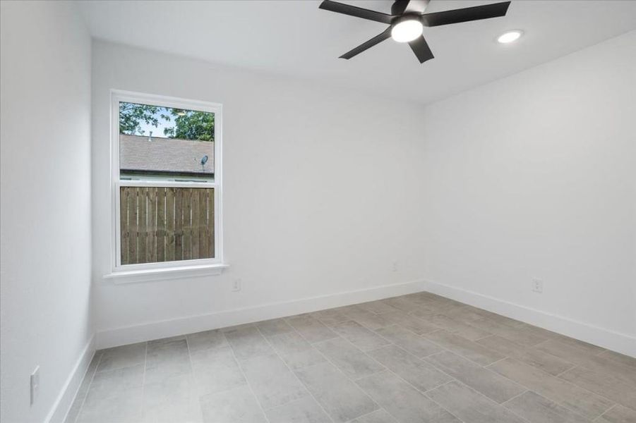 Spare room with ceiling fan