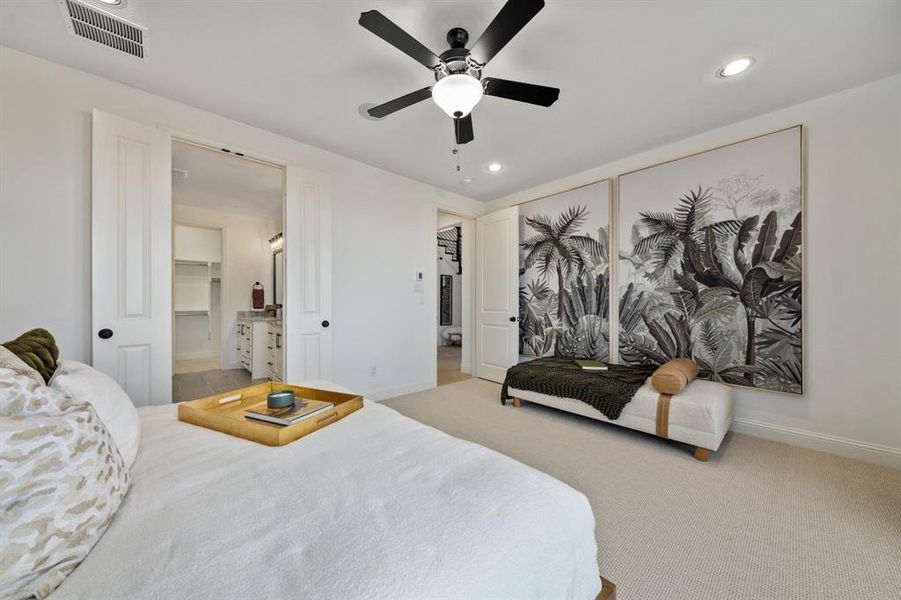 Main bedroom with a closet, ceiling fan, and a walk in closet