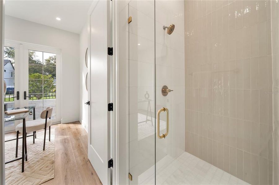 Full Bathroom with custom tile work off of the office