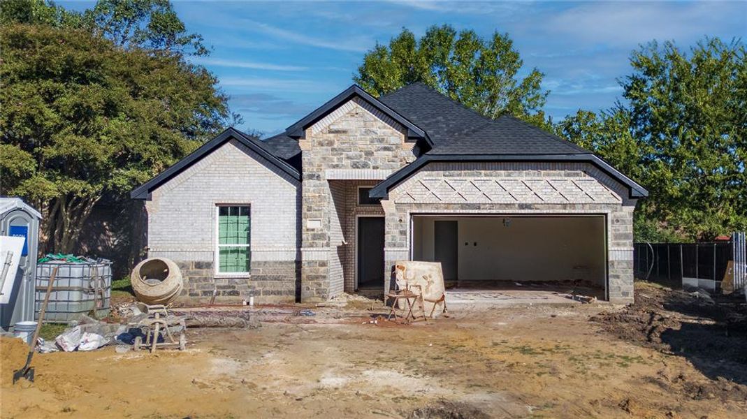 View of front of home featuring a garage