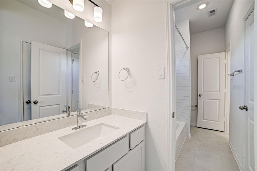 Secondary vanity in jack and jill bathroom upstairs.