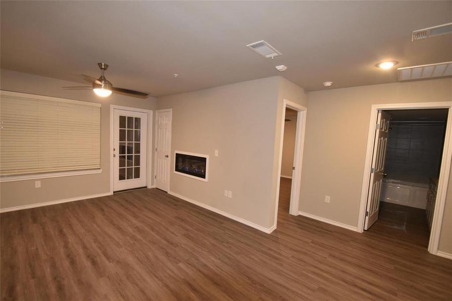 living room opens to large patio and storage.