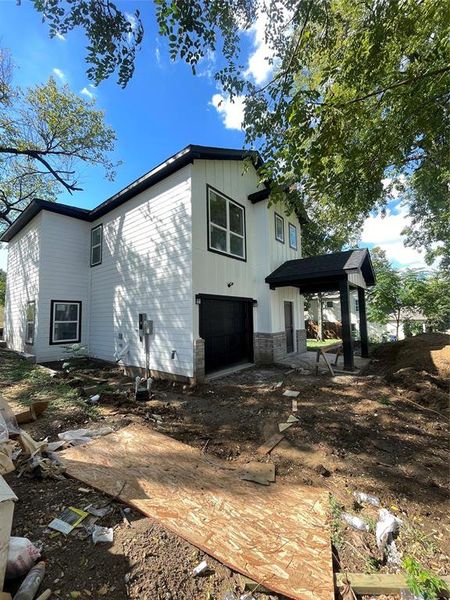 View of property exterior featuring a garage