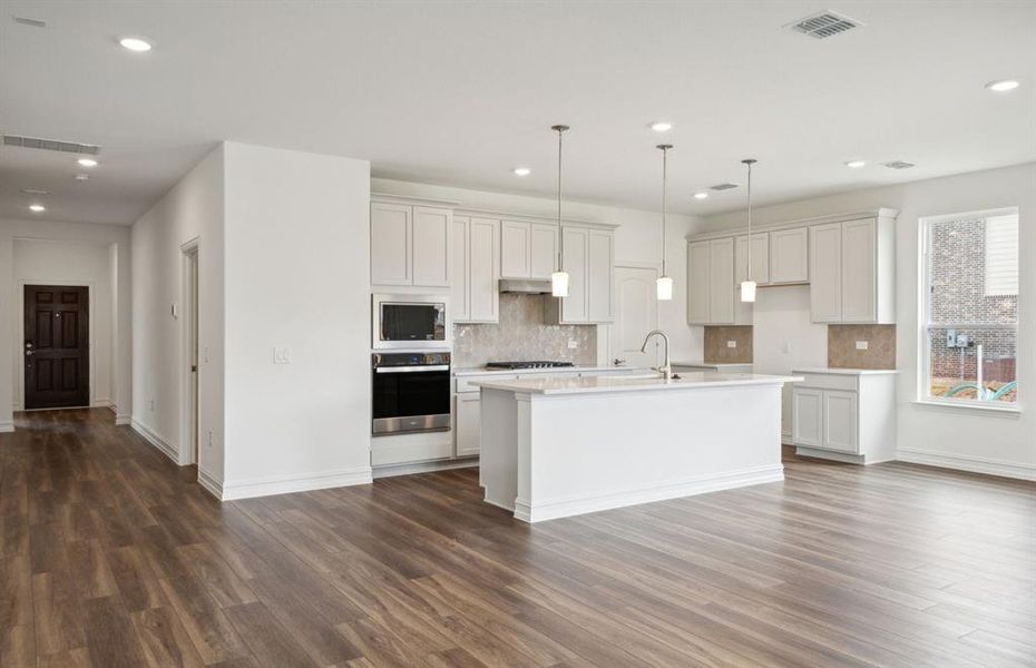 Spacious kitchen with ample cabinet space *real home pictured