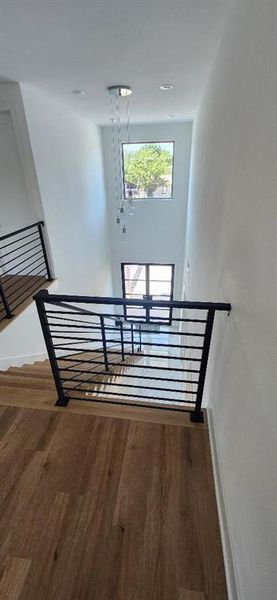 Stairs featuring wood-type flooring