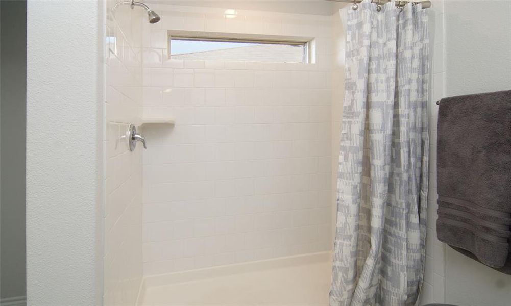 Bathroom with a shower with curtain