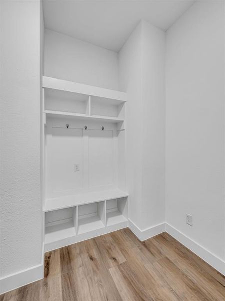 Mudroom with hardwood / wood-style floors