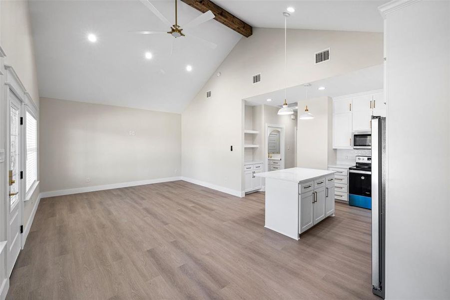 Open kitchen with white appliances