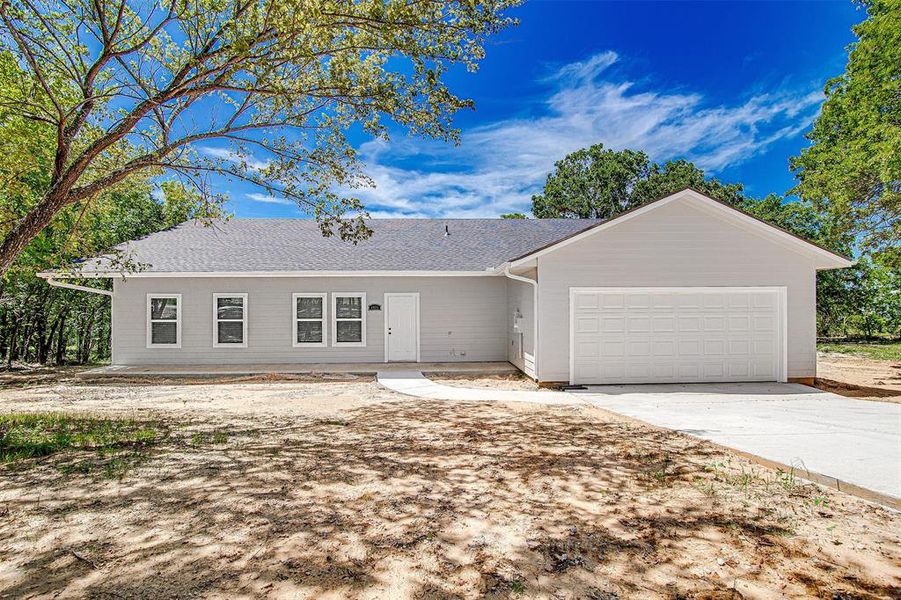 Single story home featuring a garage