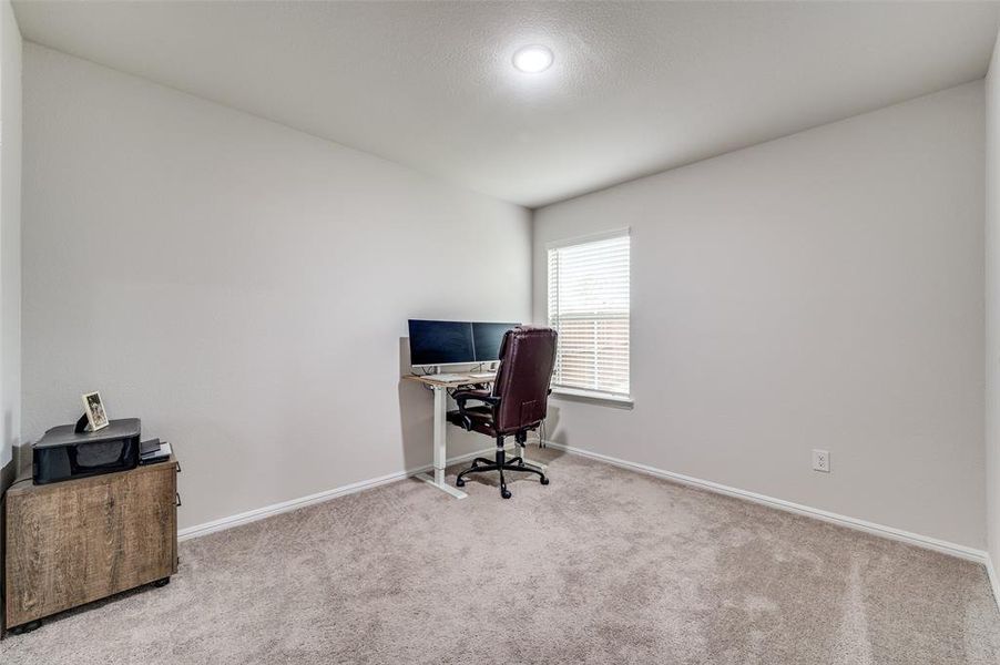 Office space with light colored carpet