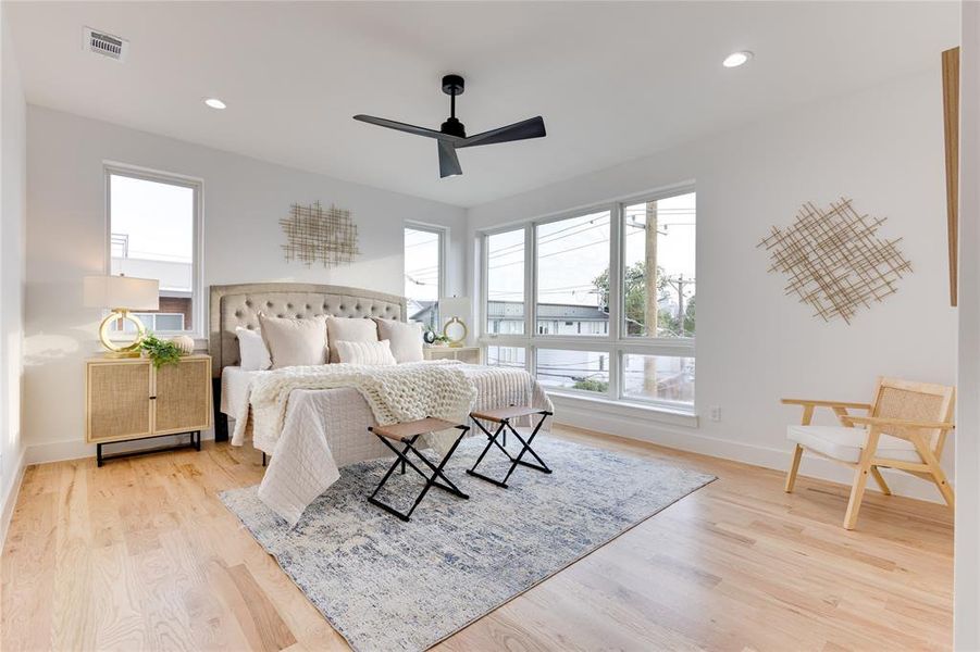 Bedroom with ceiling fan and light hardwood / wood-style floors