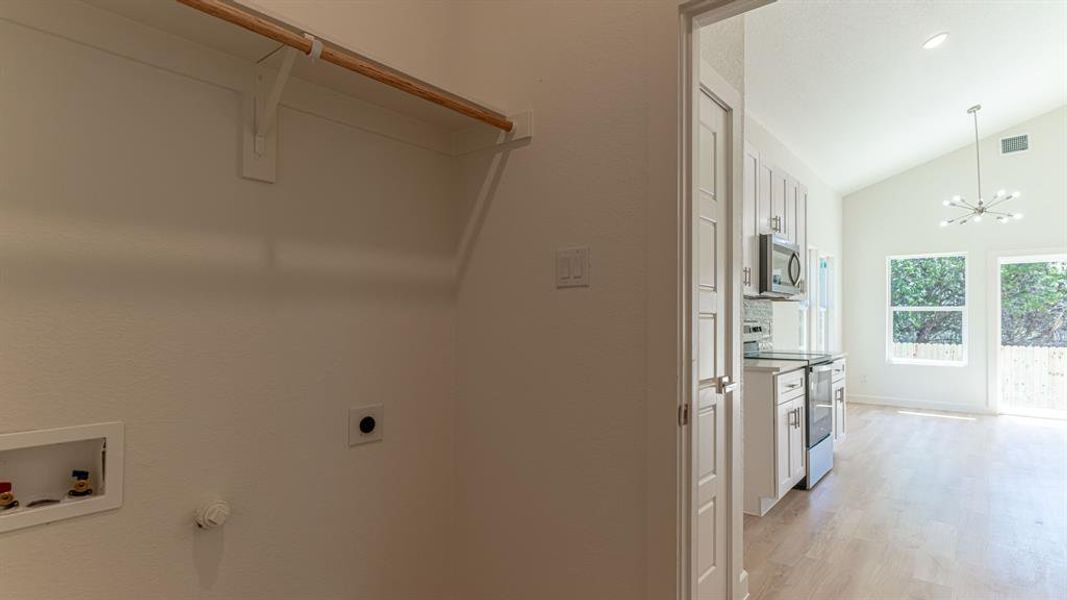 Laundry room between garage and kitchen