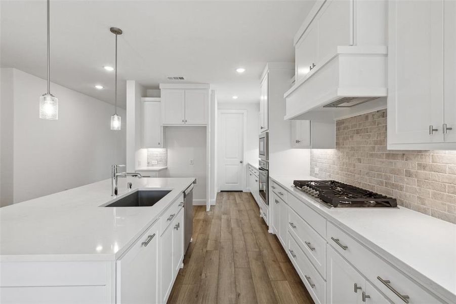 Great storage and prep space finished in a crisp white color palette make this dream kitchen one any chef would be proud to call their own!