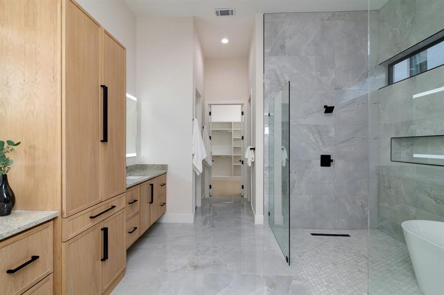 Bathroom with vanity, tile floors, and plus walk in shower