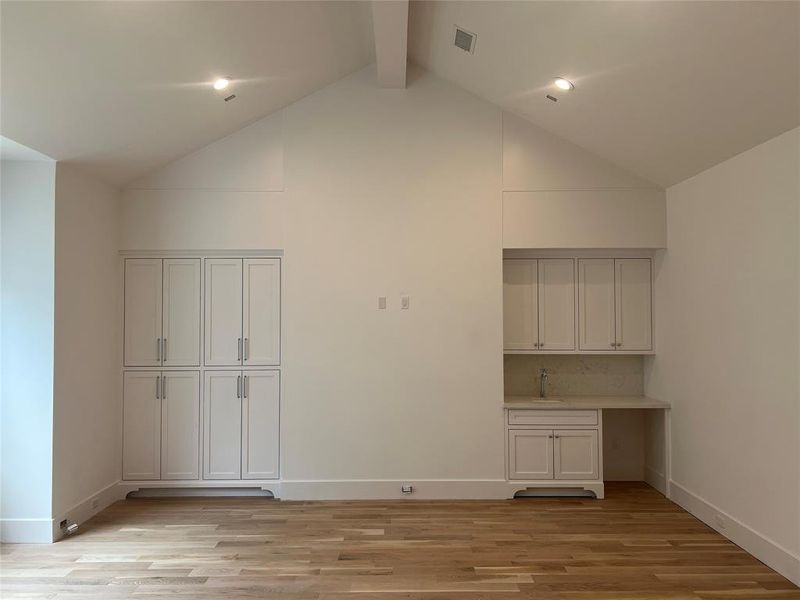 Game room with kitchenette and storage.