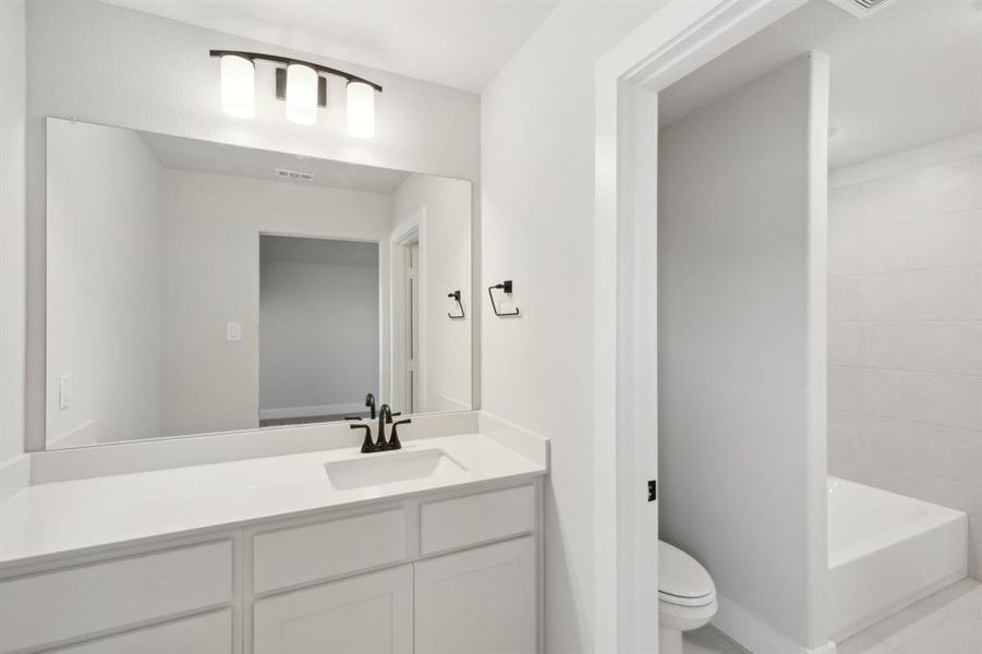 Bathroom featuring toilet and vanity