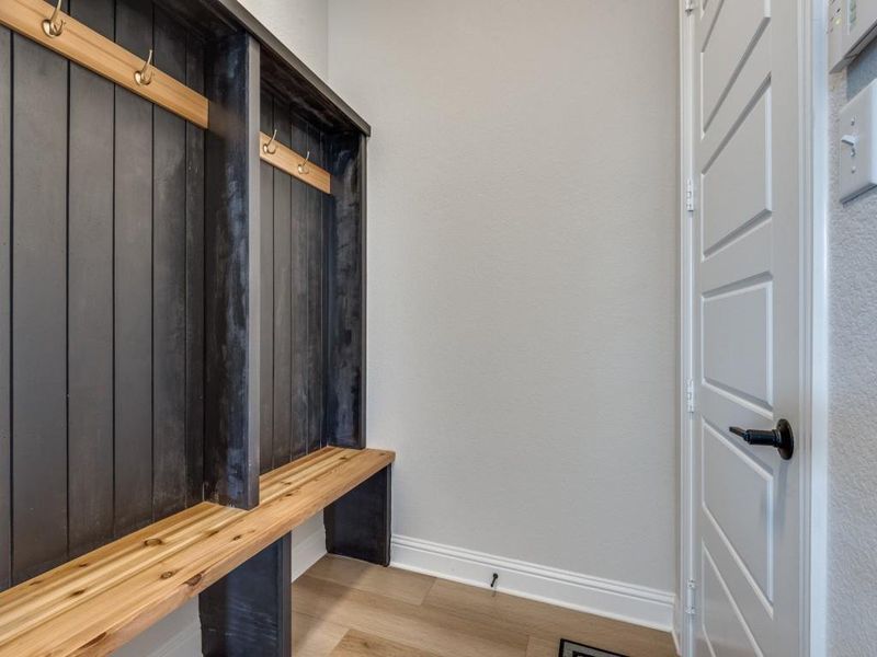 Mudroom with light hardwood / wood-style flooring