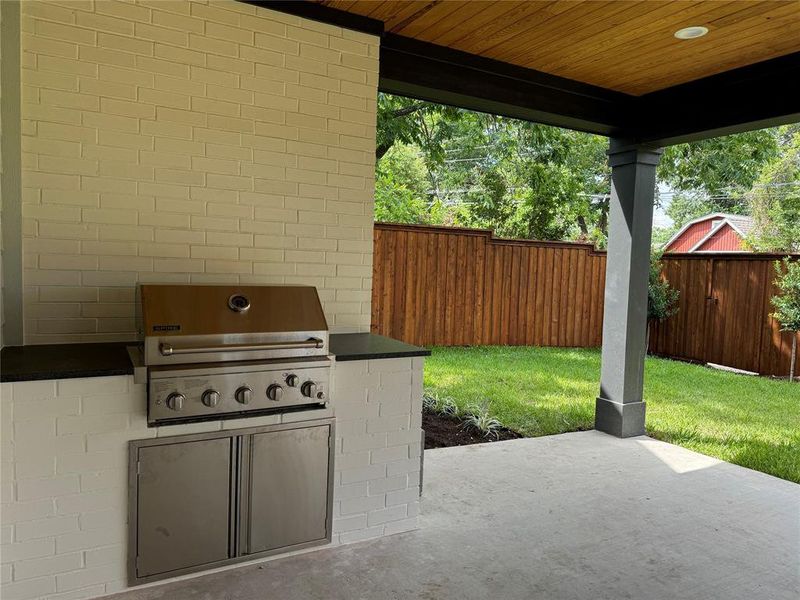 View of patio / terrace featuring grilling area and an outdoor kitchen