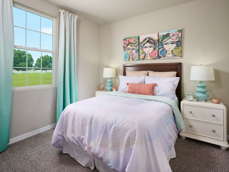 Bedroom two of the Foxglove plan modeled at The Reserve at Van Oaks.