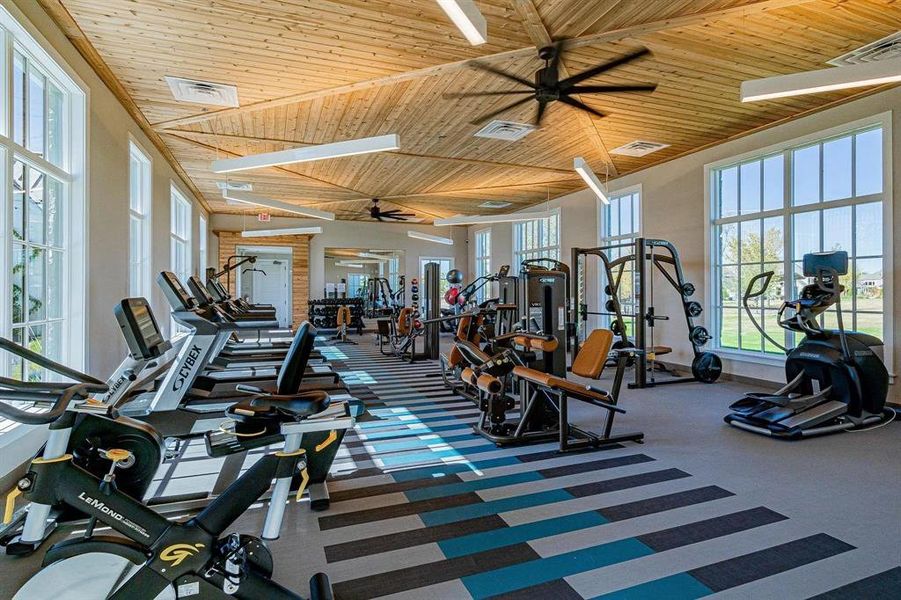 Gym with carpet and wood ceiling