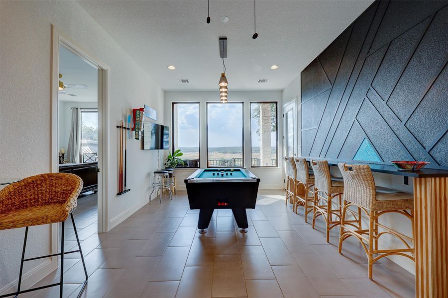 Built in Dry Bar in leathered granite and a Deco Wall give this room Lots of Character