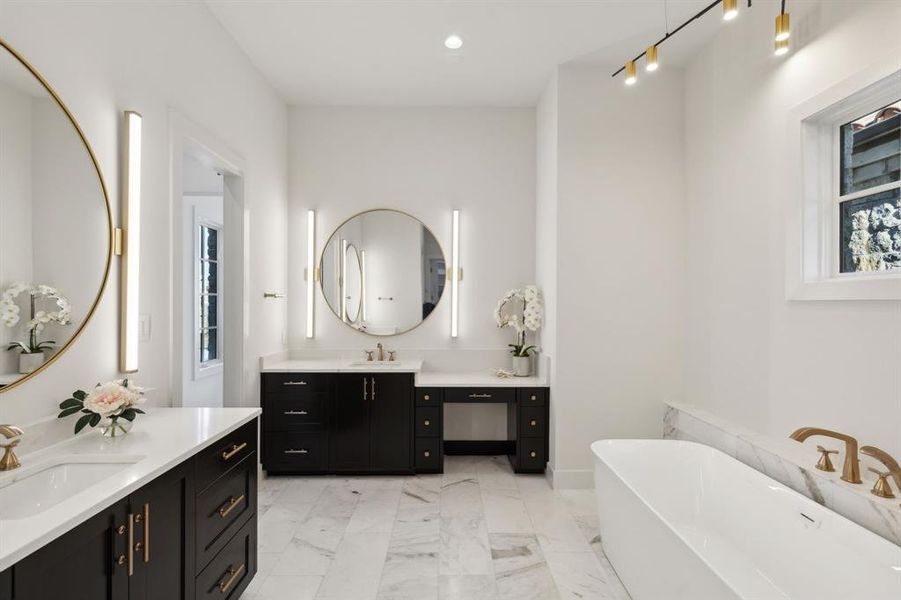 Bathroom with a wealth of natural light, tile flooring, and large vanity