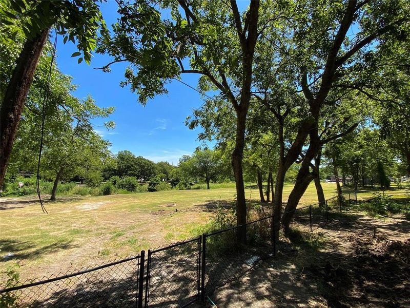 City-Owned property beyond the gated and fenced yard.