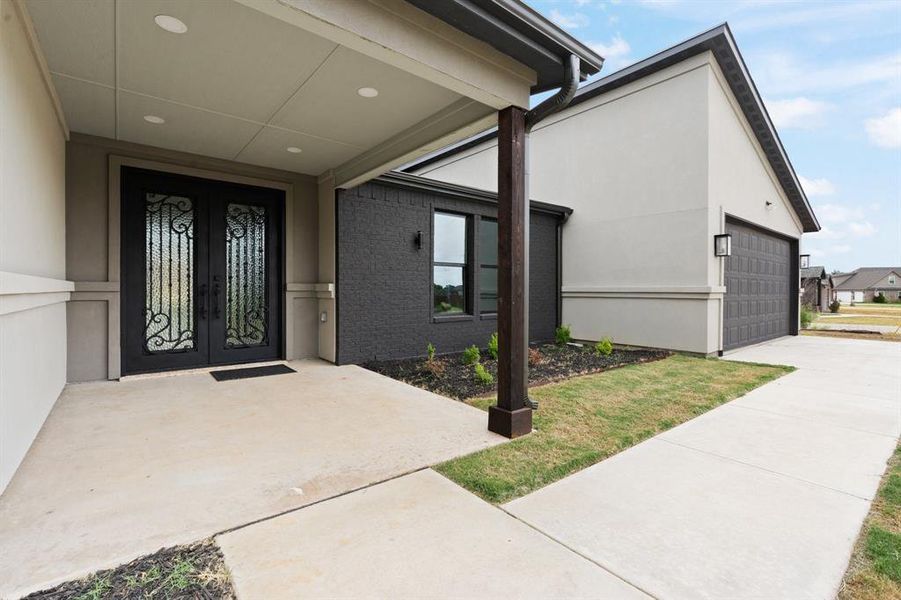 Entrance to property featuring a garage