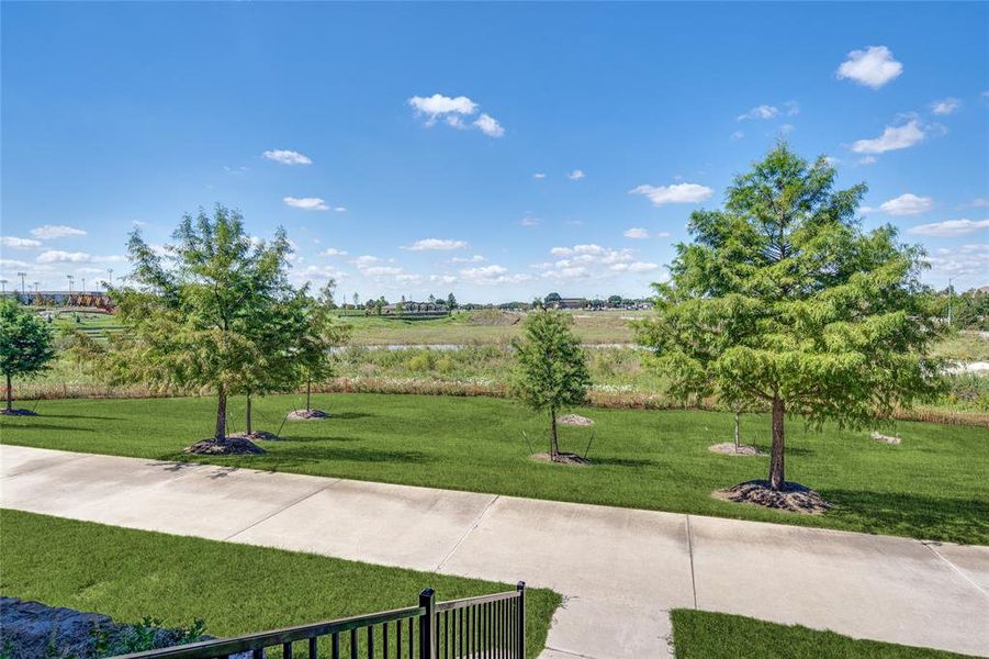 View of home's community with a yard