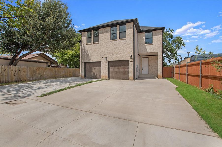 View of front of home featuring a garage