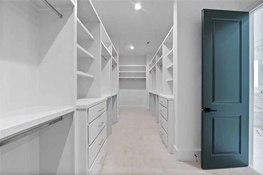 No shortage of space for your cloth and accessories in this colossal Primary closet.