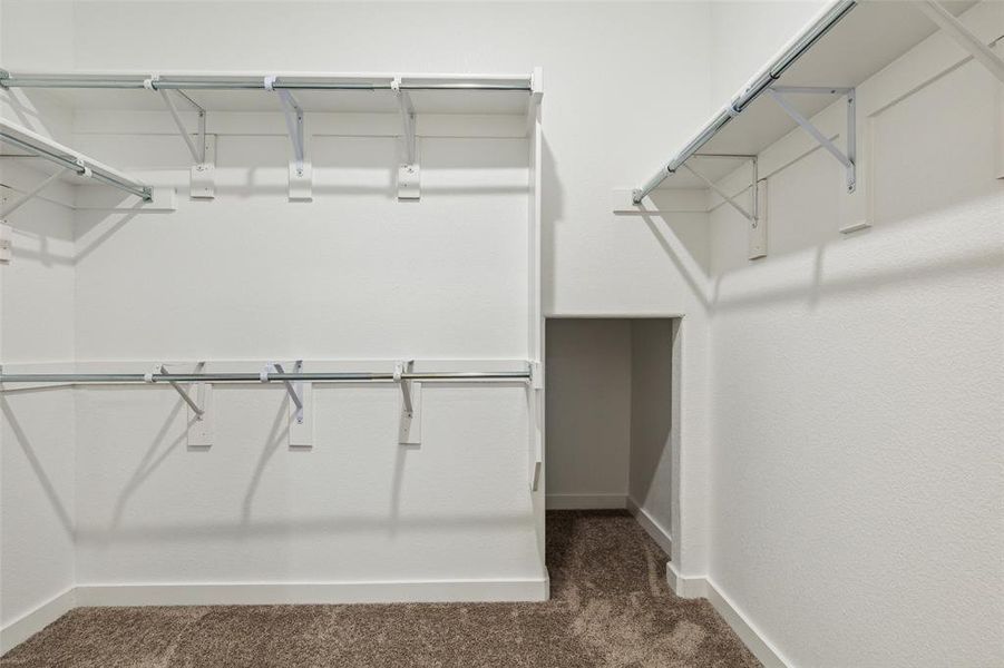 Primary walk-in closet with enough space for all your belongings.