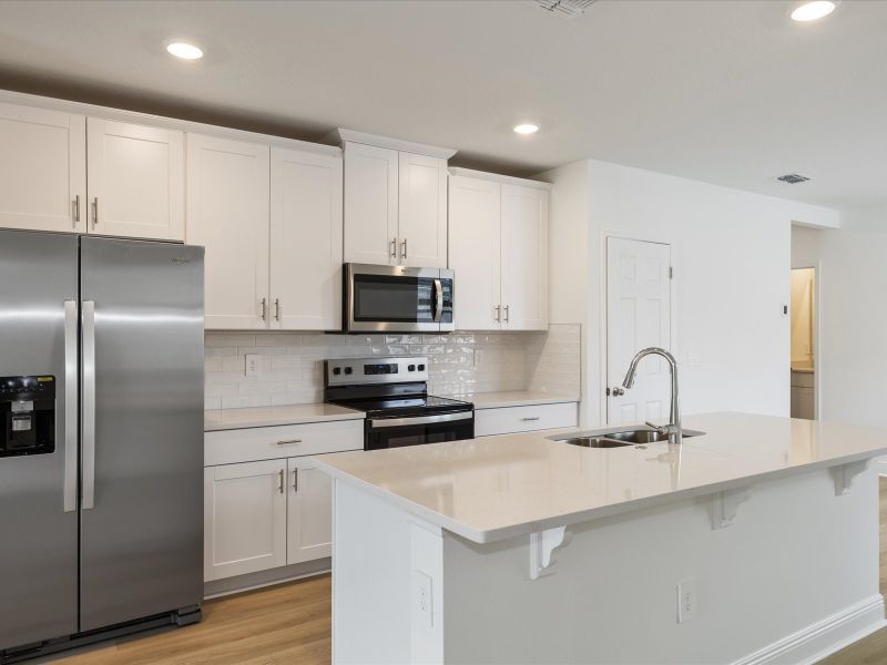 Kitchen in the Everglade floorplan at 209 Links Terrace Blvd