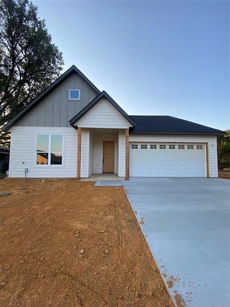 View of front facade featuring a garage