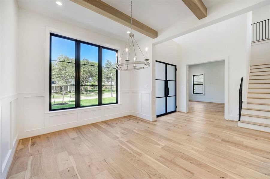 SAMPLE - Spacious dining room with beamed ceiling features large north facing Andersen windows bathing the room in natural light and offering view of tree-lined street. Dining room is pre-wired for sound.