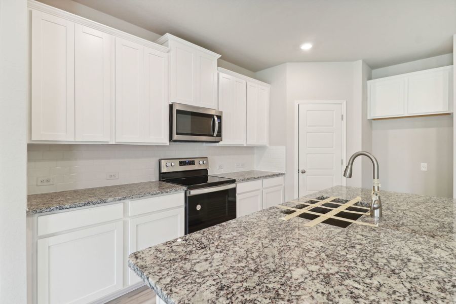 Kitchen in the Callaghan floorplan at a Meritage Homes community.