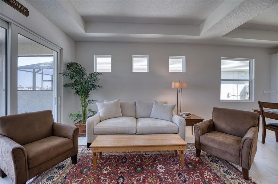 Gathering Room: Ample light floods this home.