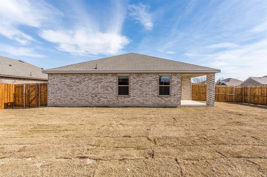 Back of property featuring a patio