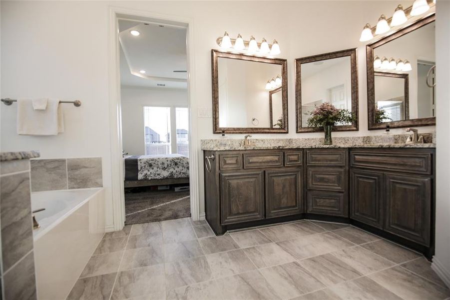 Bathroom featuring vanity and a bathing tub