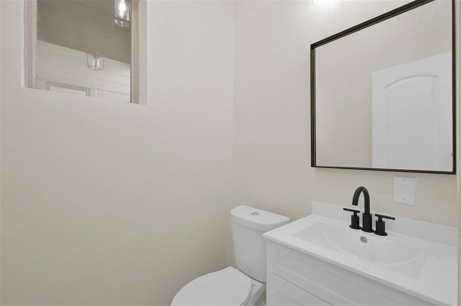 A half bath is located downstairs for convenience.