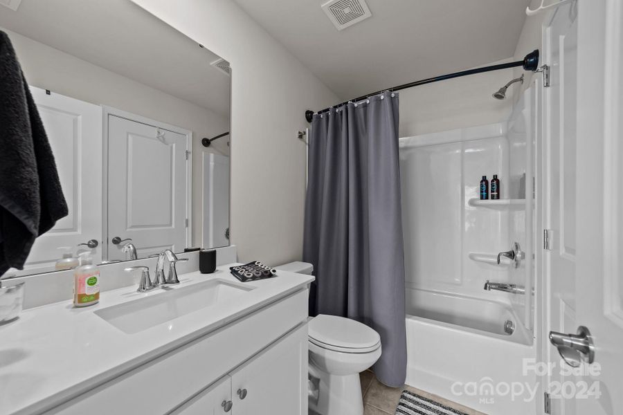 Full bathroom #3 upstairs.  Situated off the expansive loft area and bedroom, convenient and private.  Nice!