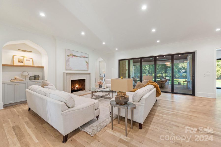 Isokern fireplace in family room with Nanowall Accordian Door leading to the screened porch.