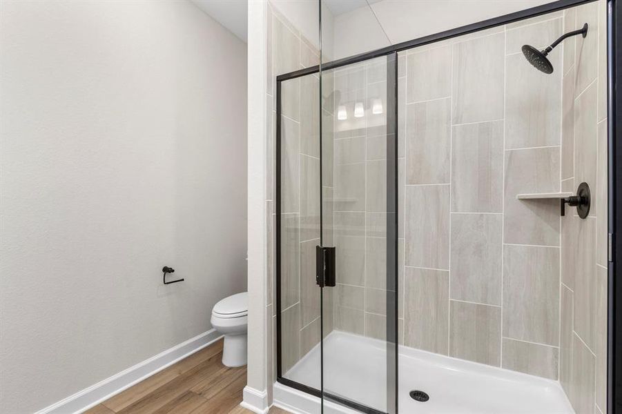 Designed for ultimate comfort and convenience, the generously sized en-suite bathroom incorporates a luxurious walk-in shower, providing ample room to move freely and indulge in a refreshing bathing experience without feeling confined.